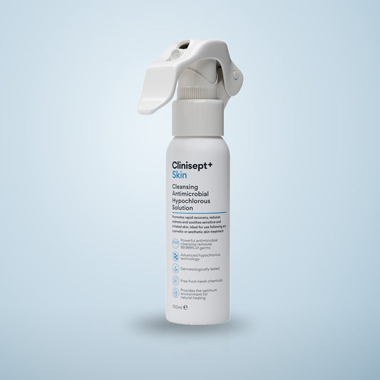 Clinisept+ Skin 100ml, a white trigger spray bottle of cleansing hypochlorous solution, on a pale blue background
