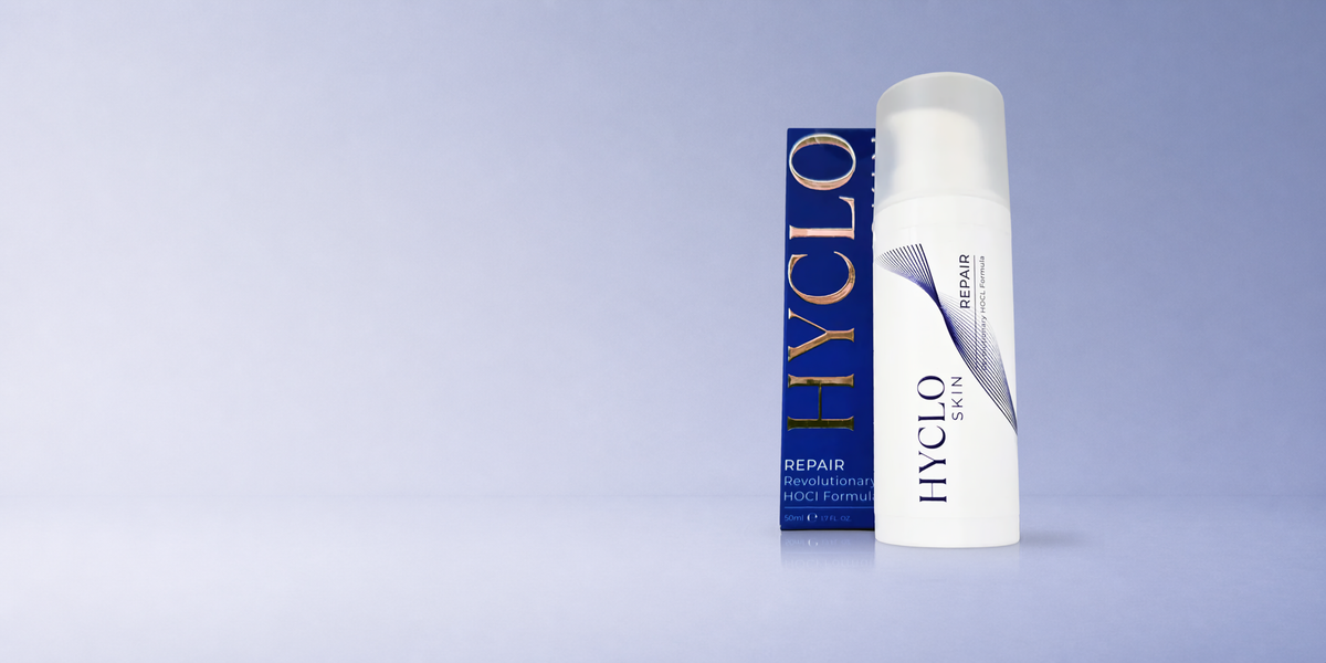 Hyclo Skin Repair, a white pump bottle of hypochlorous acid gel, standing beside its navy and gold 50ml carton
